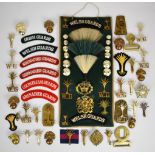 Collection of approximately 30 Grenadier and Welsh Guards badges including cap badges, shoulder