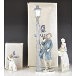 Lladro figures comprising 'The Lamplighter', girl with hen and a puppy figure 'New Friend', two