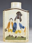 A late 18thC Prattware tea caddy with relief decoration of figures, probably King George III and
