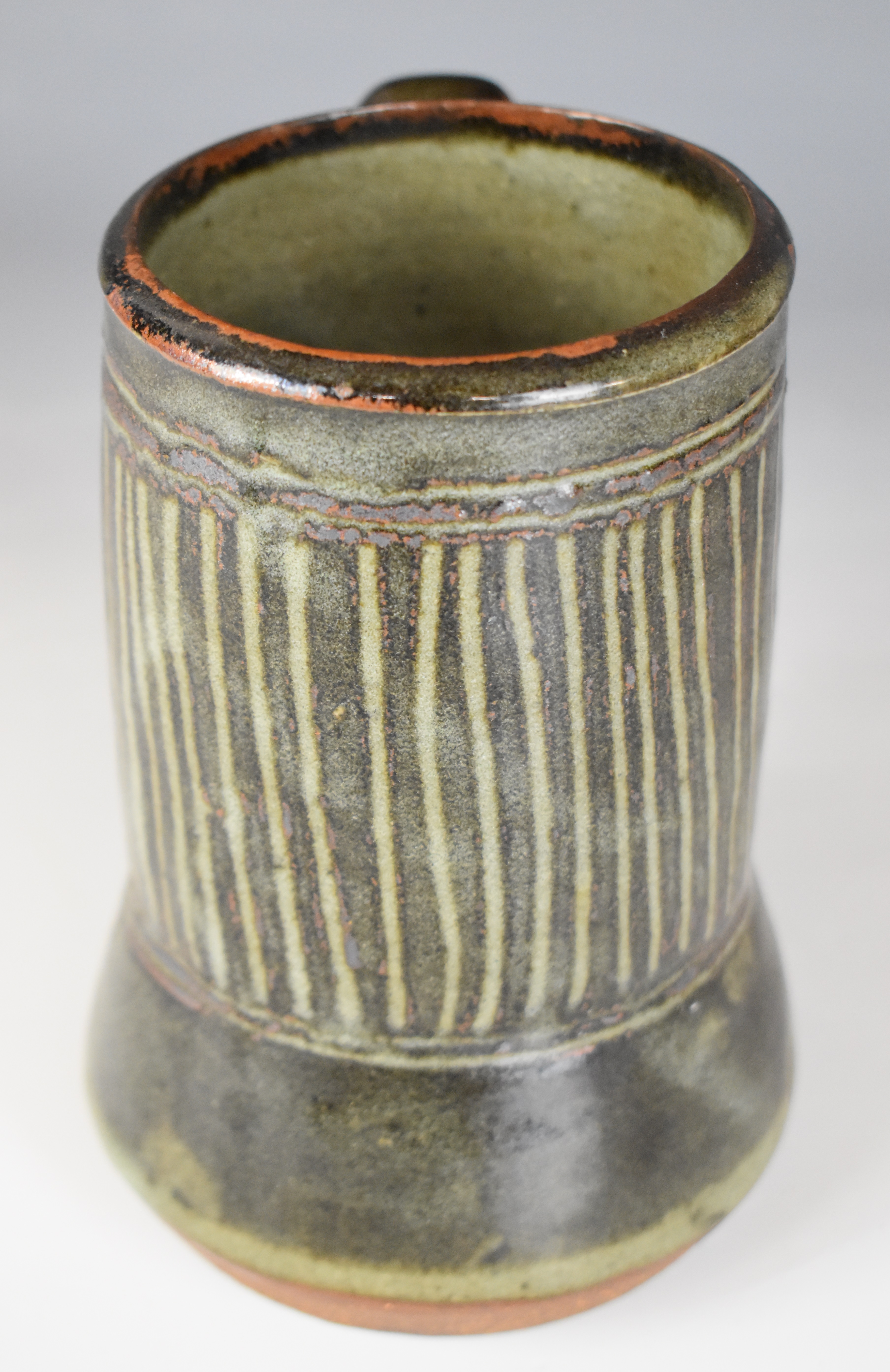 Ladi Kwali (Nigerian 1925-1984) studio pottery tenmoku glazed tankard with artist's seal, height - Image 7 of 10