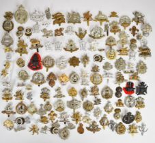 Large collection of approximately 100 British Army cap badges including Middlesex Regiment,