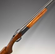 Miroku 12 bore over and under ejector shotgun with engraved locks, chequered semi-pistol grip and