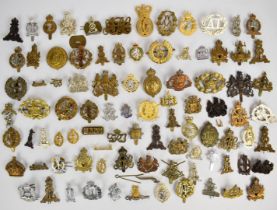 Collection of approximately 80 British Corps and other cap badges including Army Pay Corps,