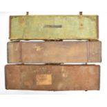 Three vintage leather and canvas bound shotgun carry cases, one with 'Army & Navy Co-operative