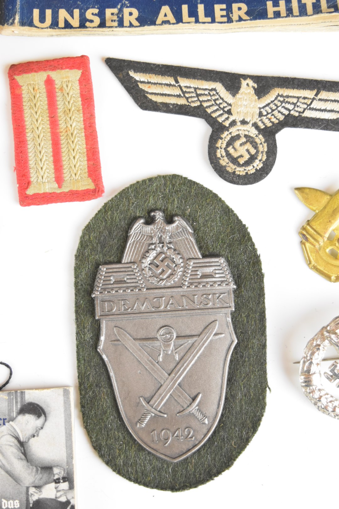 Mainly reproduction German WW2 Nazi insignia, booklets etc - Image 12 of 16