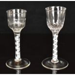 Two Georgian drinking glasses each with cotton twist stem and twisted bowl, largest 15cm tall.