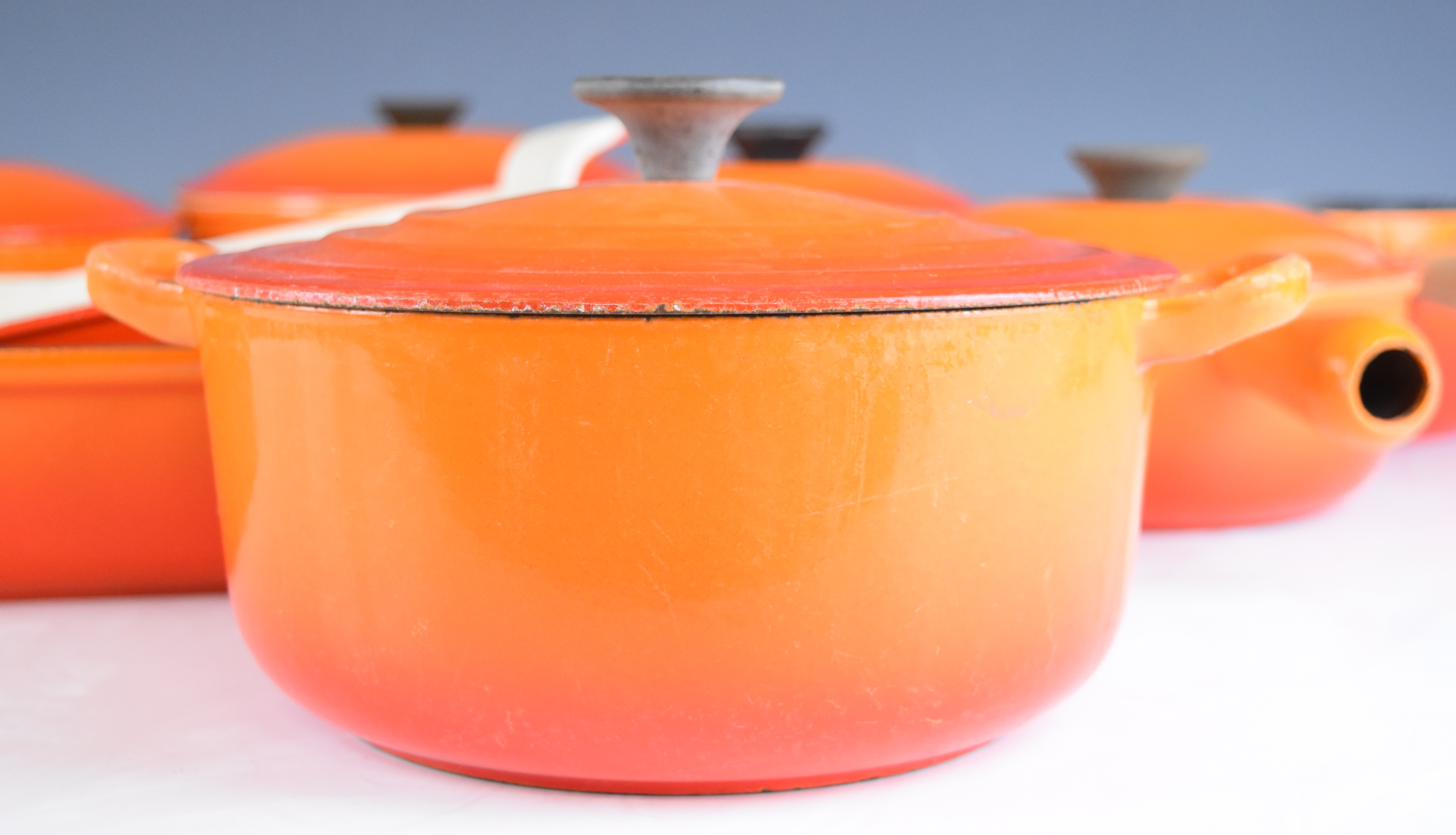 Ten items of Le Creuset cast iron cook ware in Volcanic Orange, to include lidded saucepans, milk - Image 3 of 8