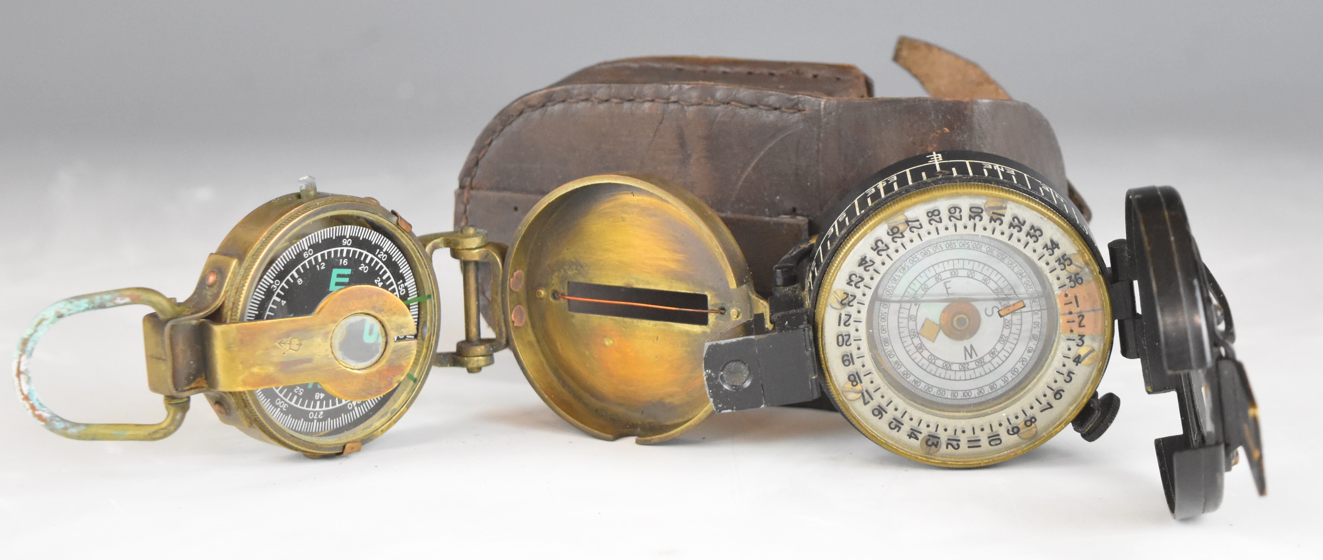 British WW2 prismatic compass by T G Co Ltd, London No B187104 1942 Mk III, with broad arrow mark,