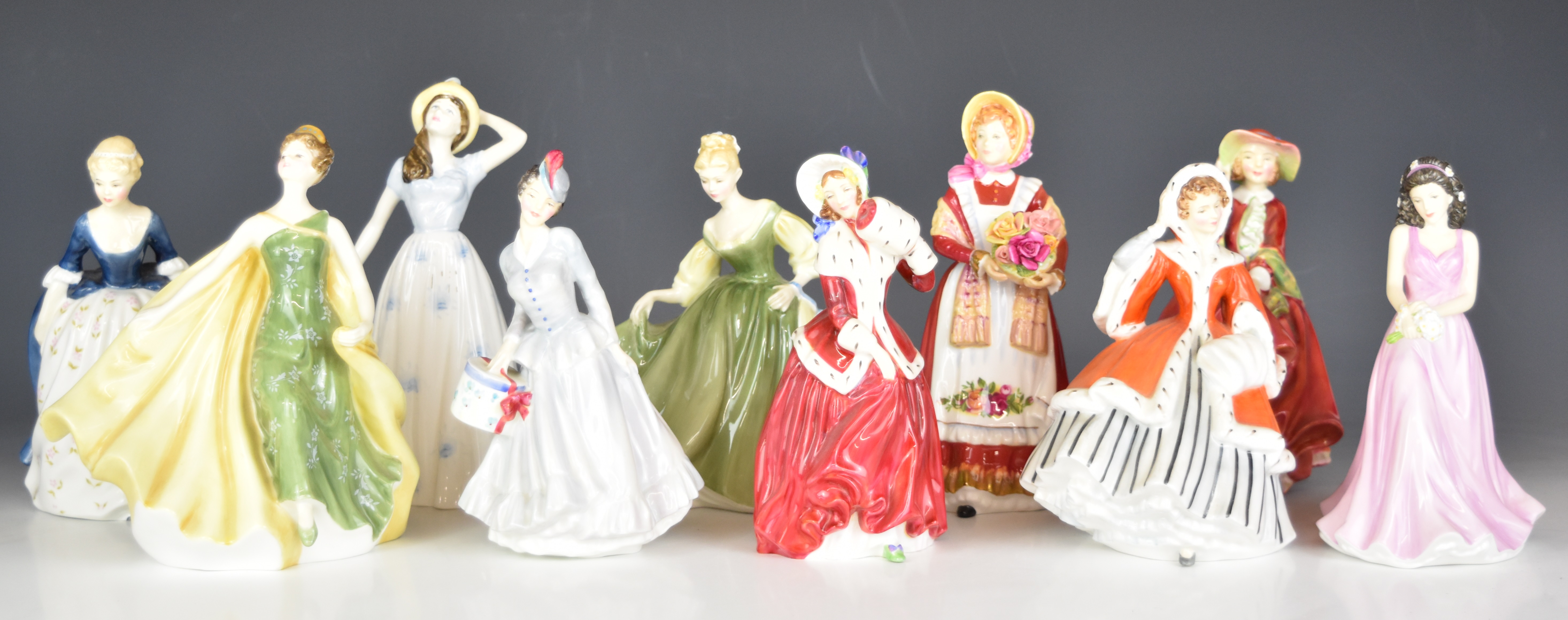 Ten Royal Doulton figurines including Old Country Roses, Midinette, Noelle and Christmas Morn,