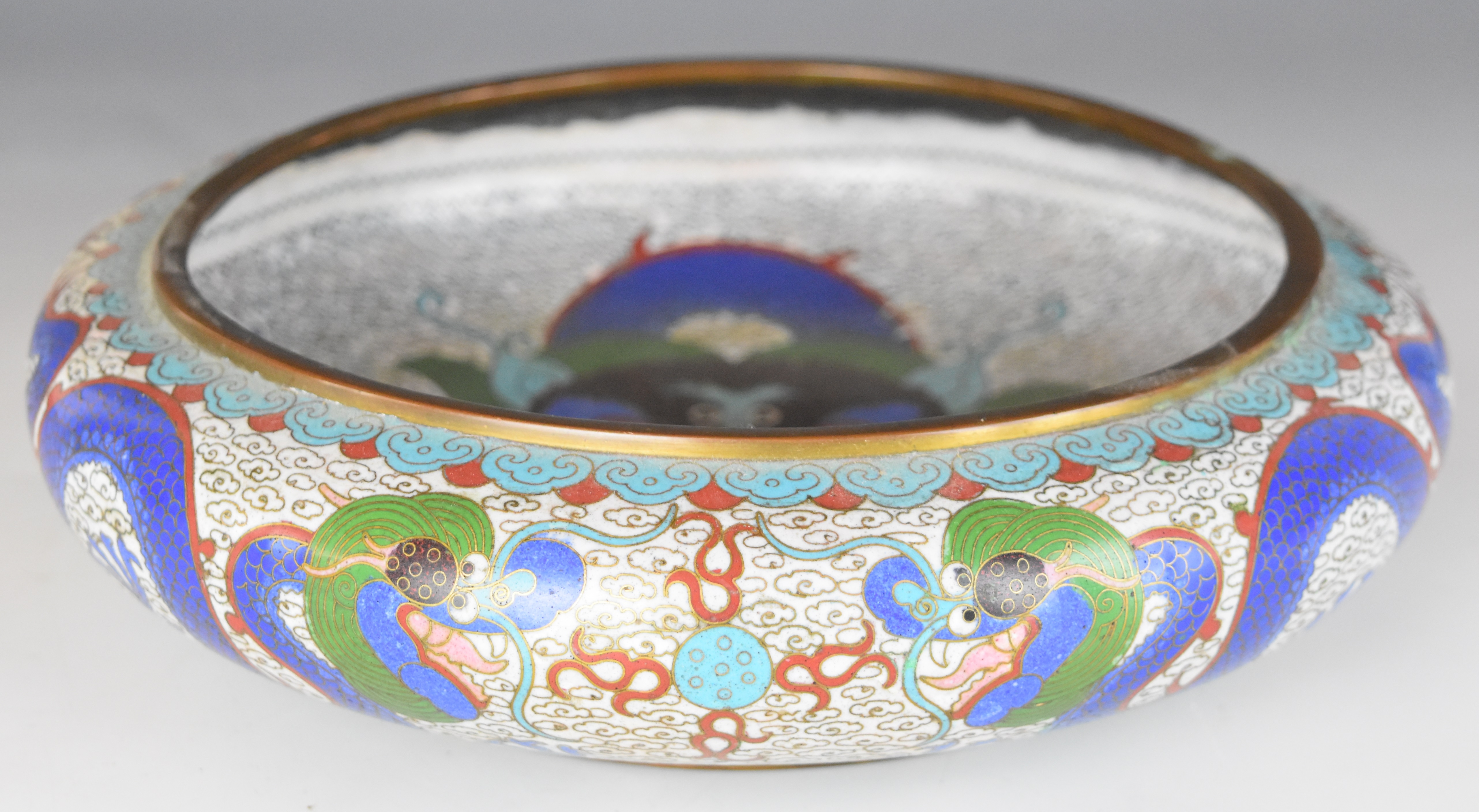 Chinese cloisonné bowl decorated with dragons, with four character mark to base, 26cm in diameter.