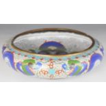 Chinese cloisonné bowl decorated with dragons, with four character mark to base, 26cm in diameter.