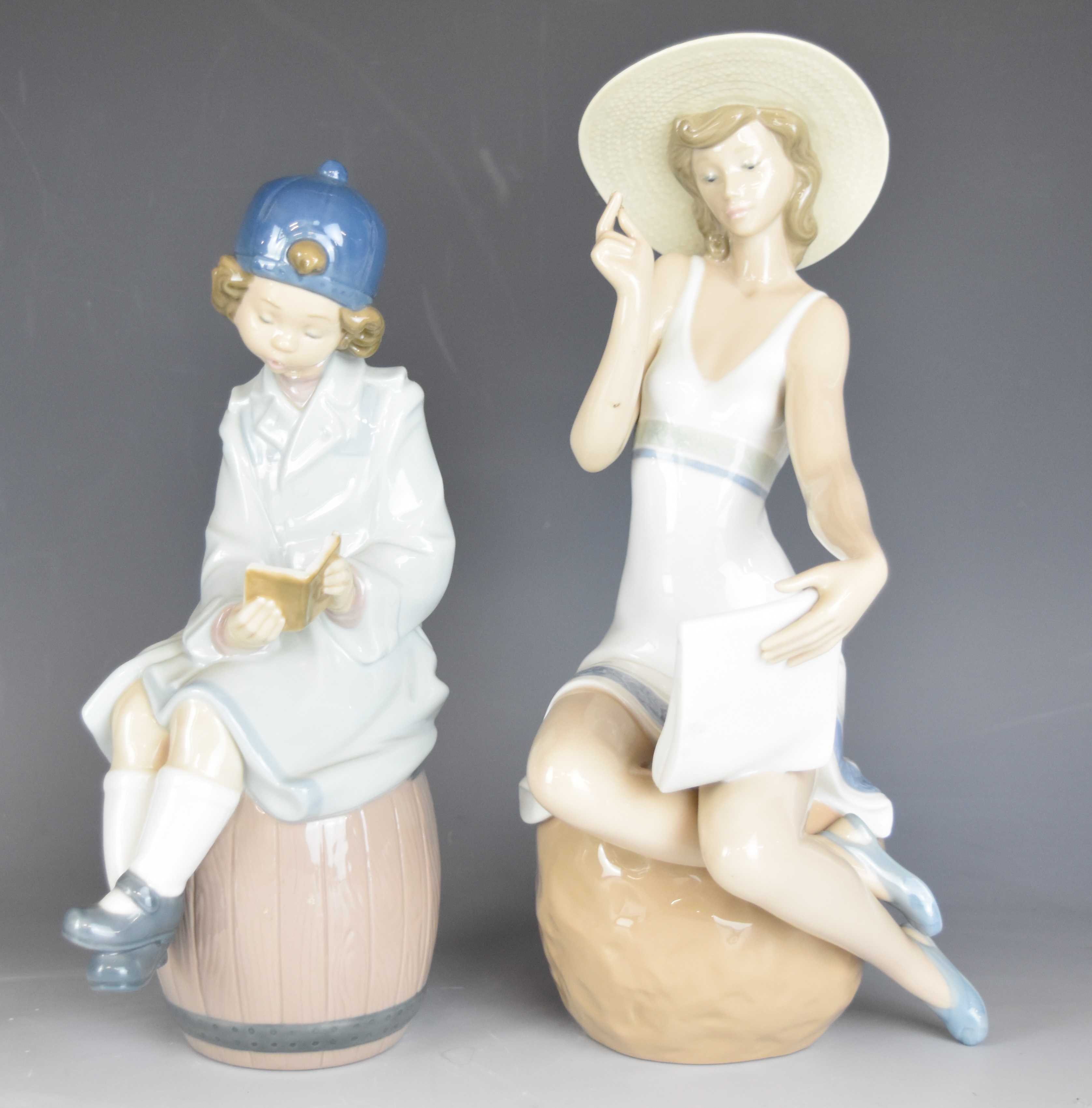 A collection of Lladro and Nao figurines and an advertising stand, tallest 32cm - Image 13 of 14