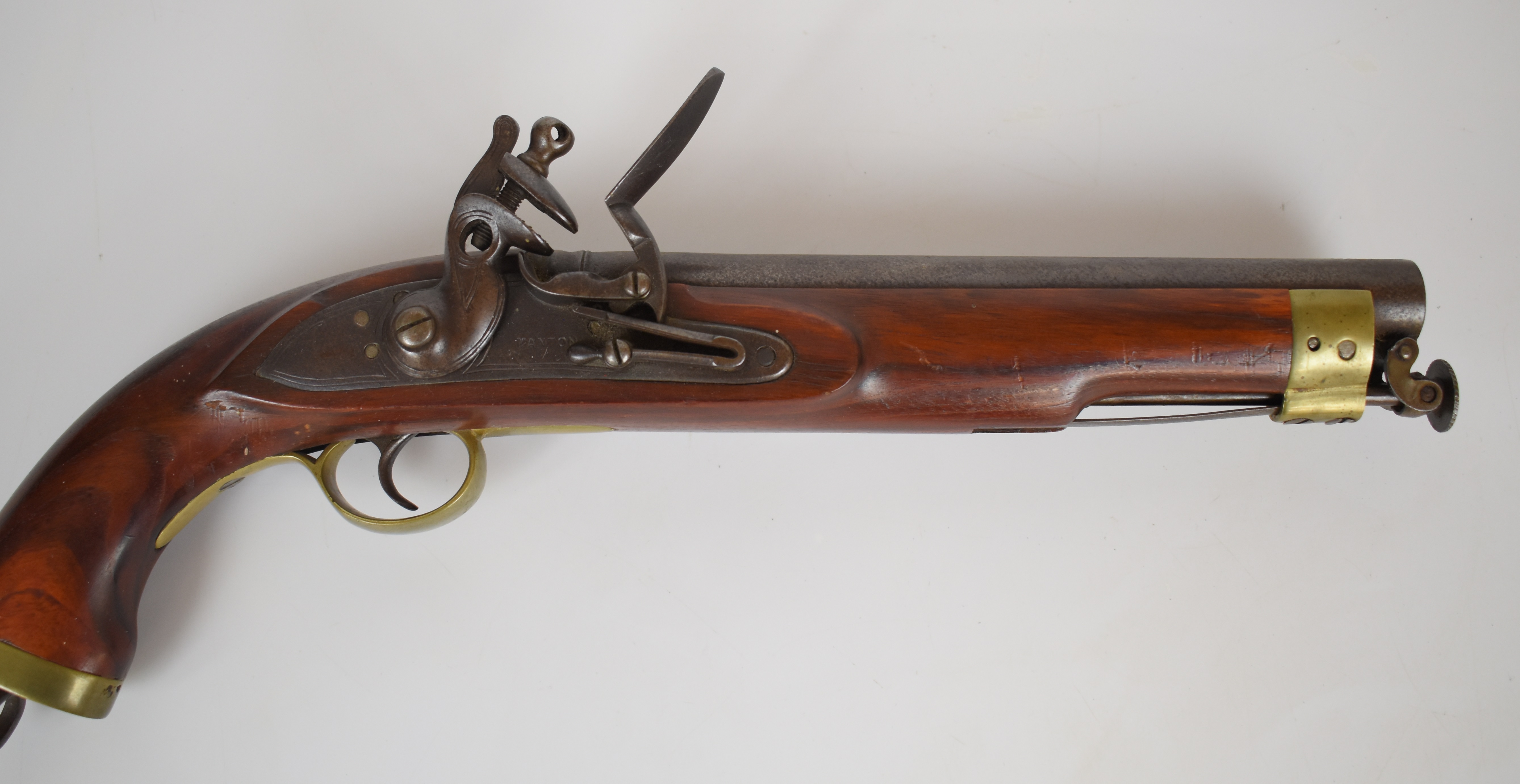 Replica flintlock pistol with lock stamped 'Manton', brass trigger guard, butt plate and mounts,
