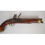 Replica flintlock pistol with lock stamped 'Manton', brass trigger guard, butt plate and mounts,