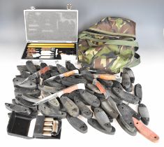 A collection of gun accessories including Midwater PCP cylinder carry bag, recoil pads, shotgun