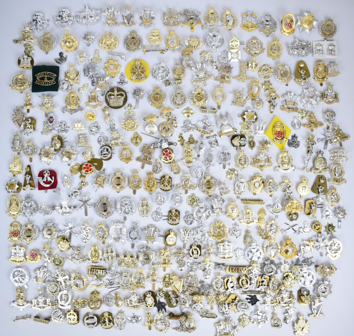 Collection of approximately 300 British Forces anodised cap badges across all arms including