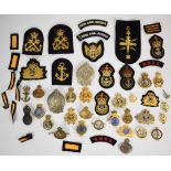 Collection of approximately 40 Royal Navy bullion and cloth and metal badges including Royal Navy