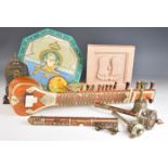 Collection of Indian / Tibetan collectibles including a sandstone sculpture of feet, graduated