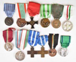 Twelve Italian WW2 medals including War Merit Cross, Mother's Fascists Medal, Campaign Medal,