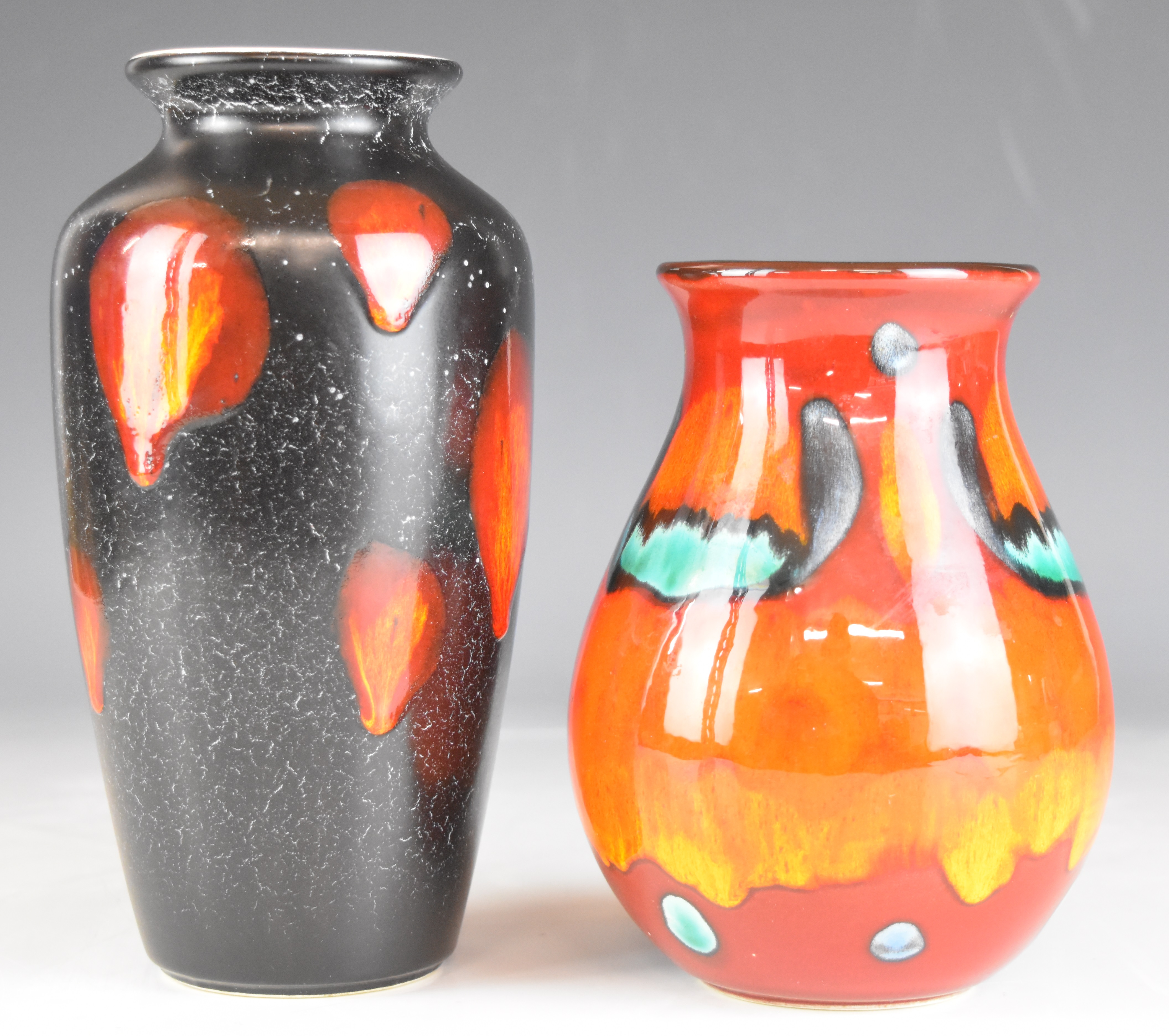 Two Poole Pottery vases, with orange glaze, tallest 21cm