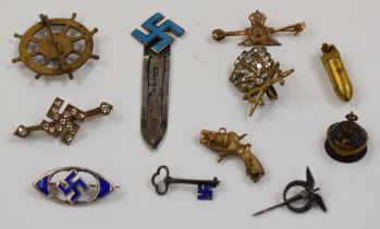 Eleven sweetheart brooches / charms including silver and enamel with swastika motif, pickelhaube