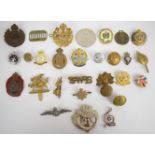 Approximately fifteen British Army cap badges including Royal Engineers plastic economy by Stanley &
