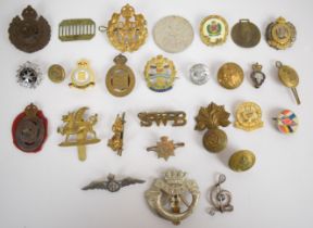 Approximately fifteen British Army cap badges including Royal Engineers plastic economy by Stanley &