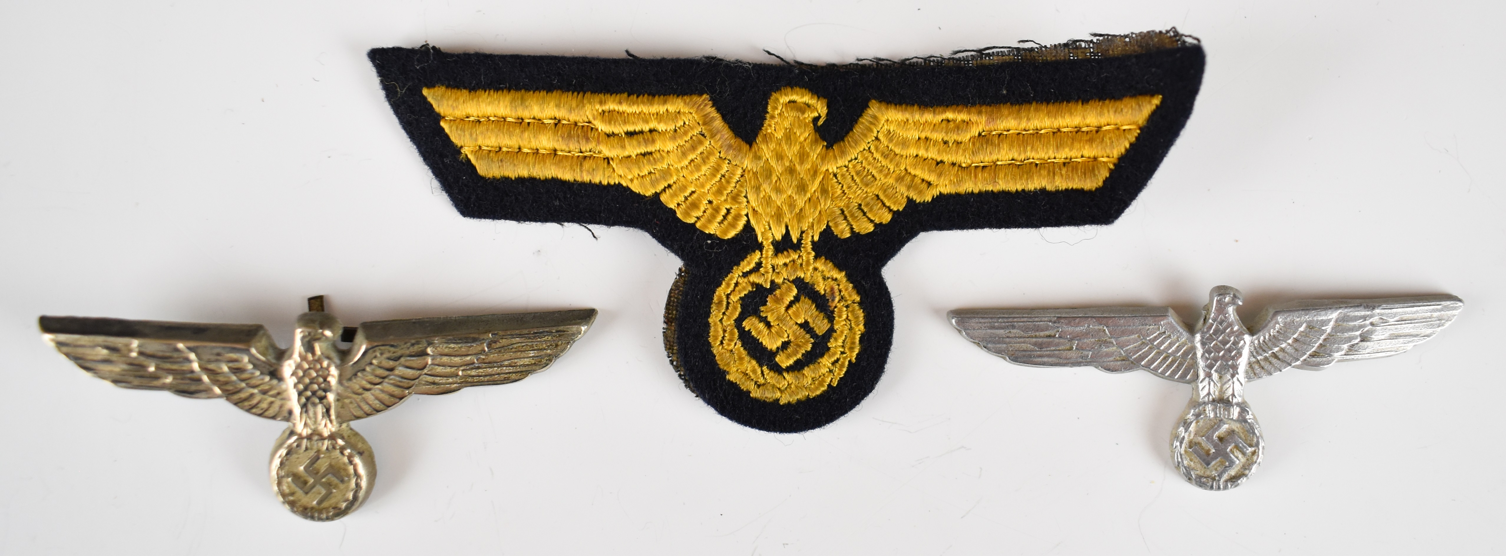 Three German WW2 Nazi Third Reich Eagle badges including a cloth example