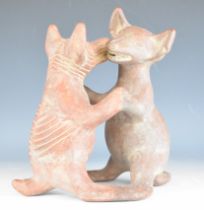 Terracotta figure group, possibly Tasmanian devils, signed Contes, height 29cm