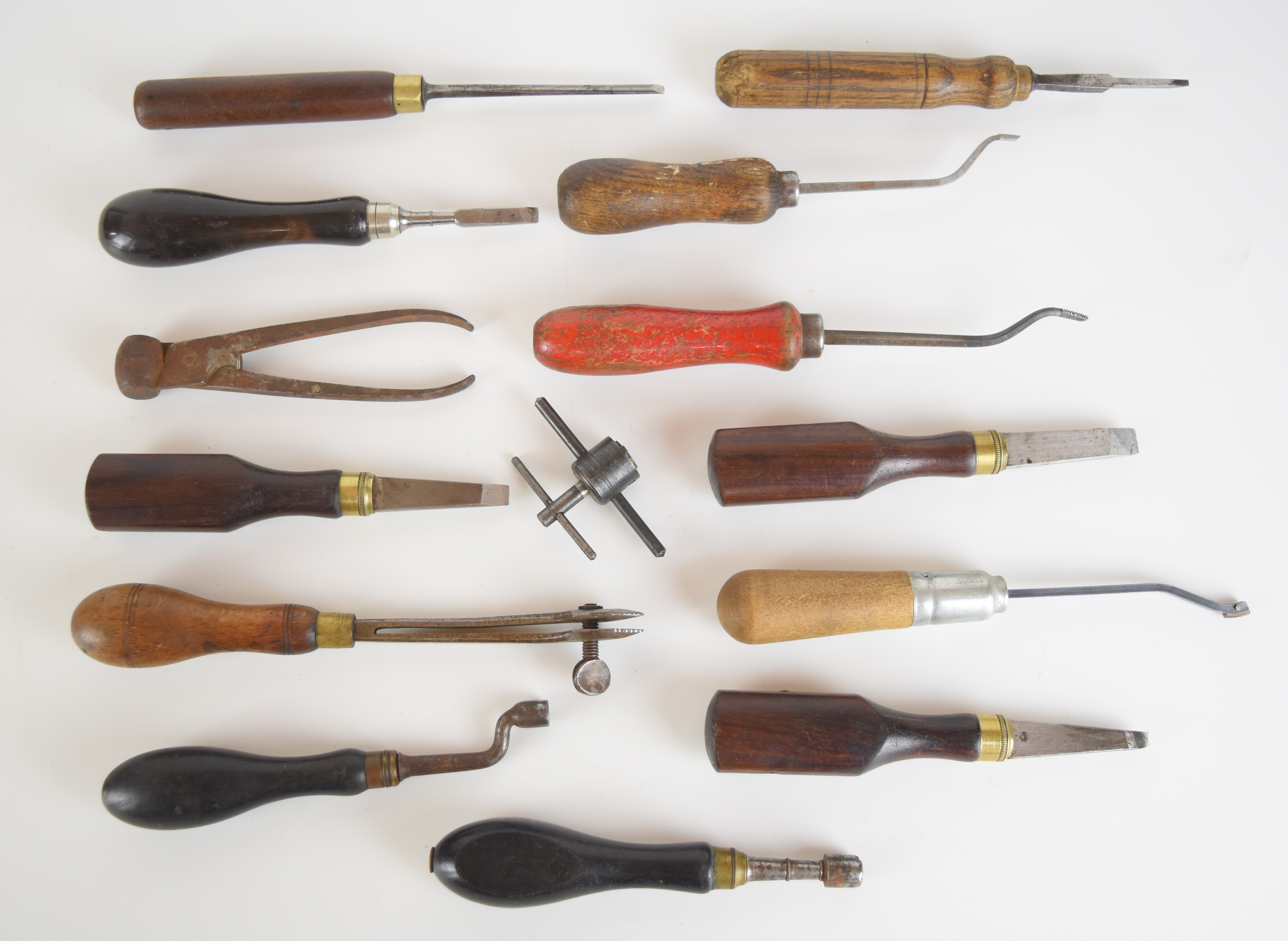 Fourteen vintage gun or gunsmith tools including screwdrivers, bullet moulds, chequering tools,