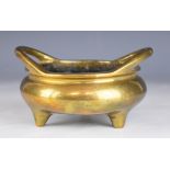 Chinese bronze twin handled censer with six character mark to base, raised on three feet, width