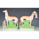 Pair of 19thC Staffordshire Greyhound figures, height 25cm