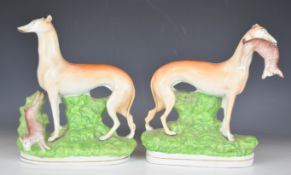 Pair of 19thC Staffordshire Greyhound figures, height 25cm