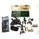 A collection of shooting accessories including gun foresights, Scope Enhancer, gun lights etc.