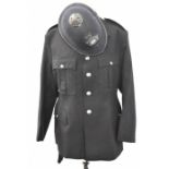 Police Officer's tunic with associated insignia and buttons together with a helmet with