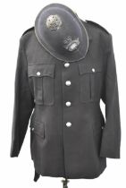 Police Officer's tunic with associated insignia and buttons together with a helmet with
