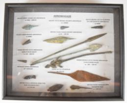 Mounted display of ancient arrow heads including Greek, Celtic, Roman, Viking and Danish, case