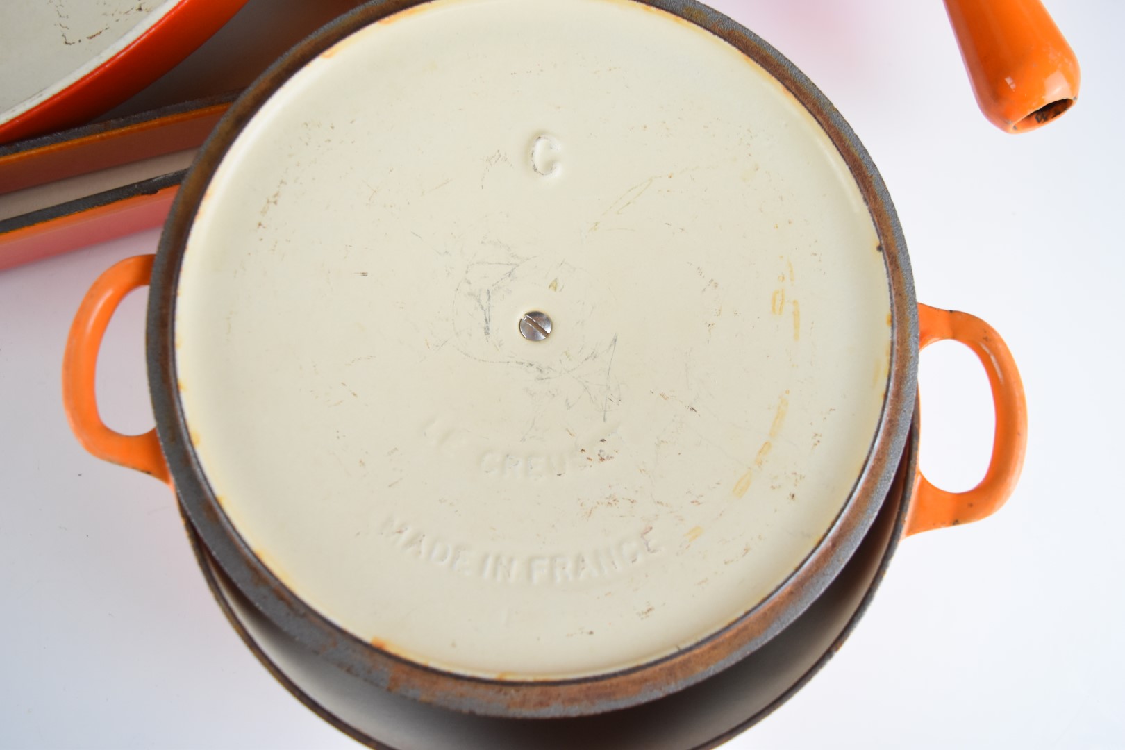 Ten items of Le Creuset cast iron cook ware in Volcanic Orange, to include lidded saucepans, milk - Image 4 of 8