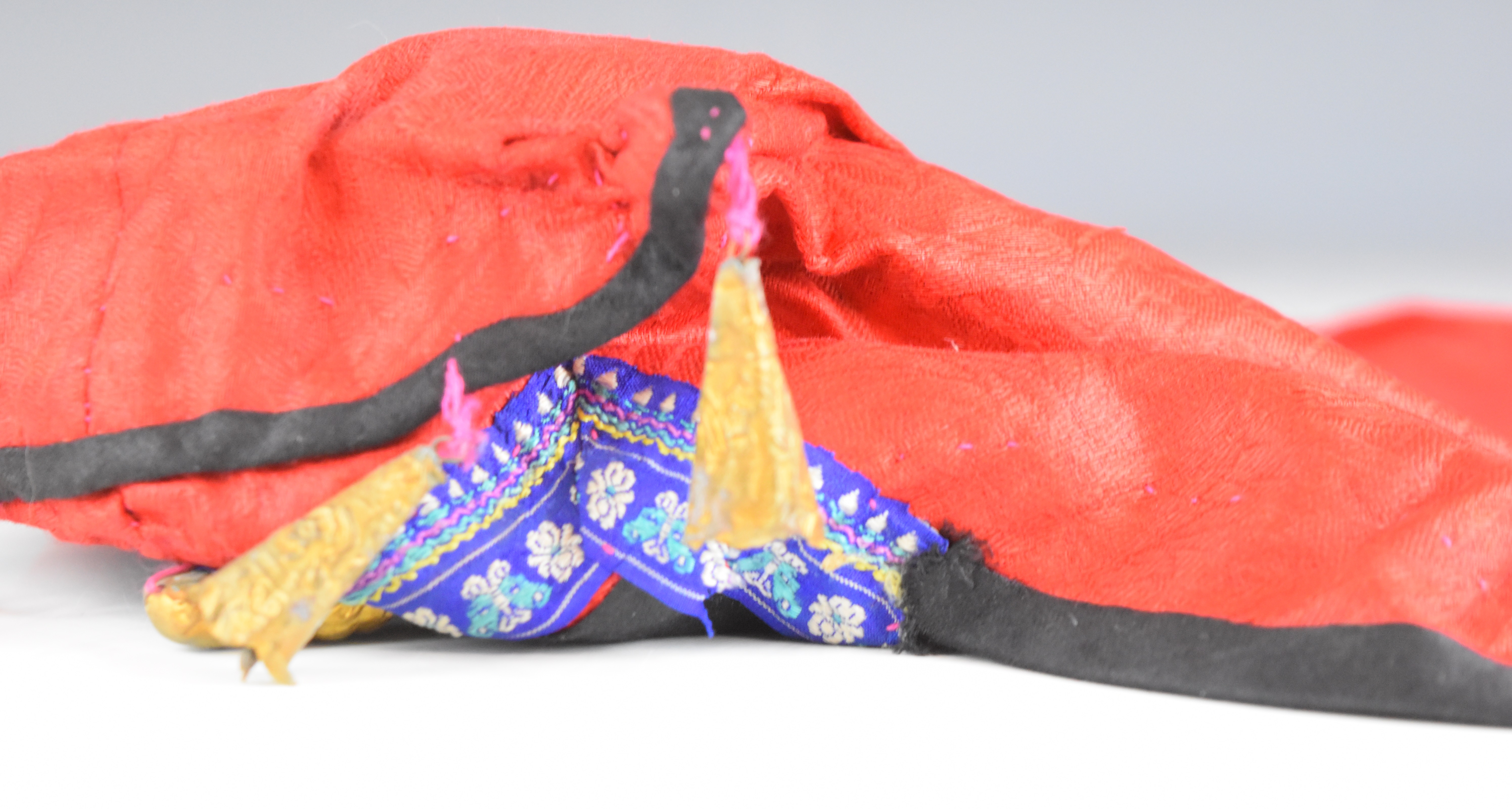 Two Chinese embroidered hats with metal Buddha and bell ornaments, together with an embroidered silk - Image 8 of 10