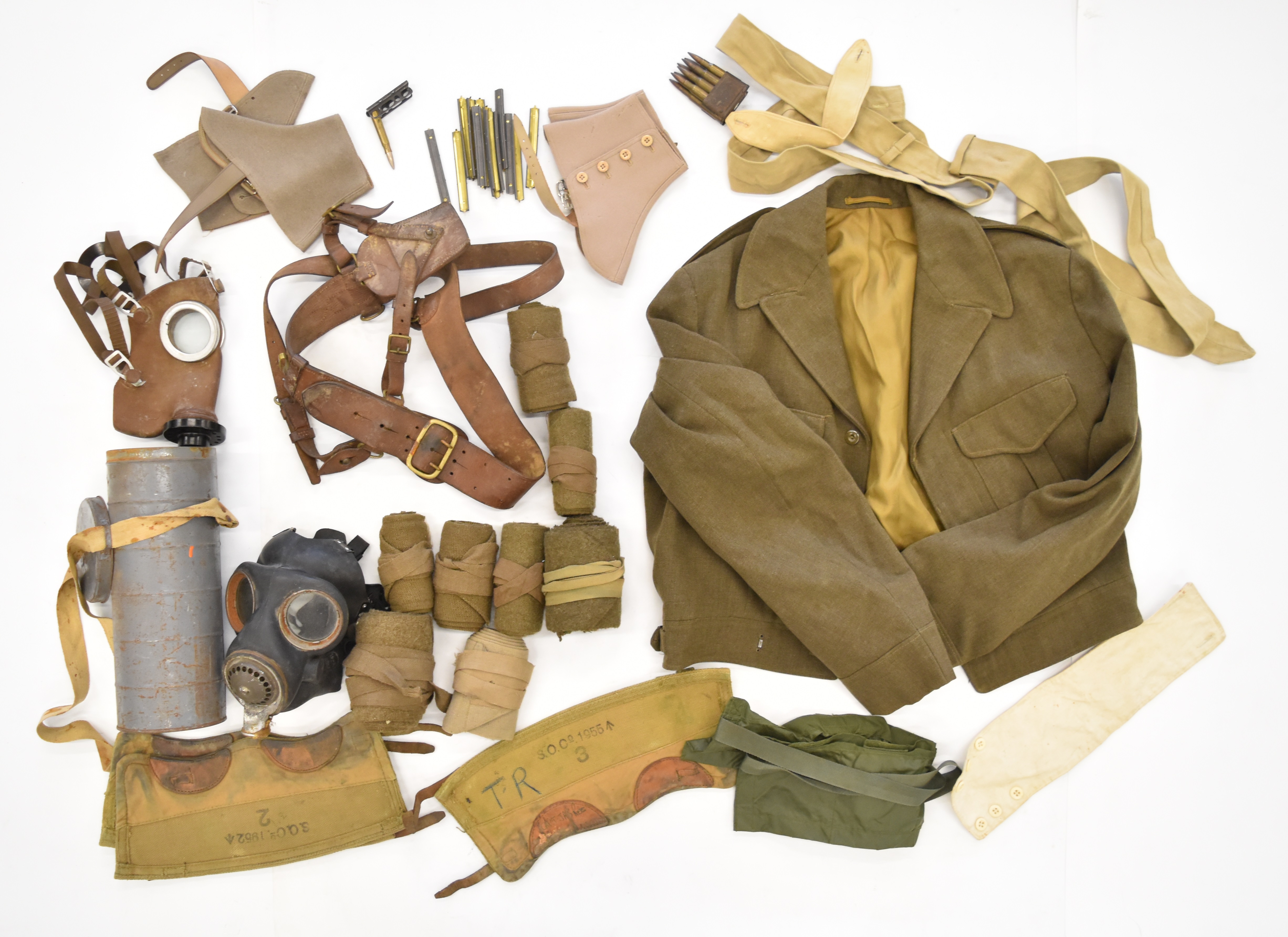 Military equipment including French respirator / gas mask in tin, Sam Browne belt, battle dress