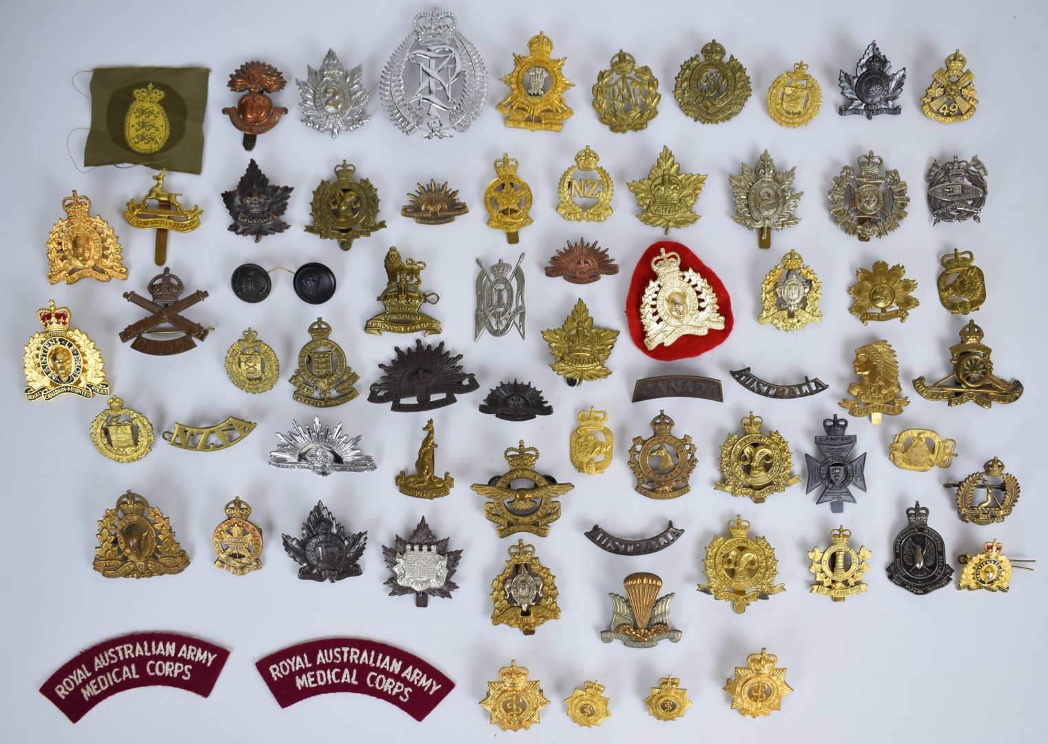 Collection of approximately 60 Canadian, New Zealand and Australian badges including Canadian