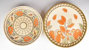 Two Art Deco Crown Ducal chargers with tube lined decoration, one signed Charlotte Rhead, largest