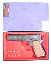 BBM Bruni 8mm blank firing pistol with chequered wooden grips, in original fitted box.