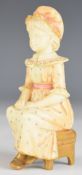 Royal Worcester Kate Greenaway style seated figurine, with puce backstamp, height 10.5cm
