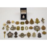 Small collection of badges including Northamptonshire Regiment, Guards Machine Gun Corps, King's