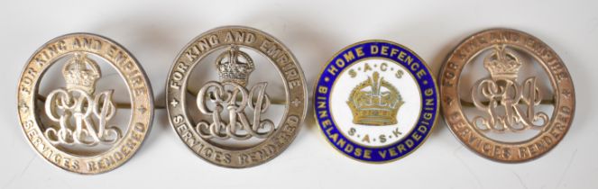 Three silver War Badges marked SA2912, SA7046 and SA5860, together with South Africa Home Defence