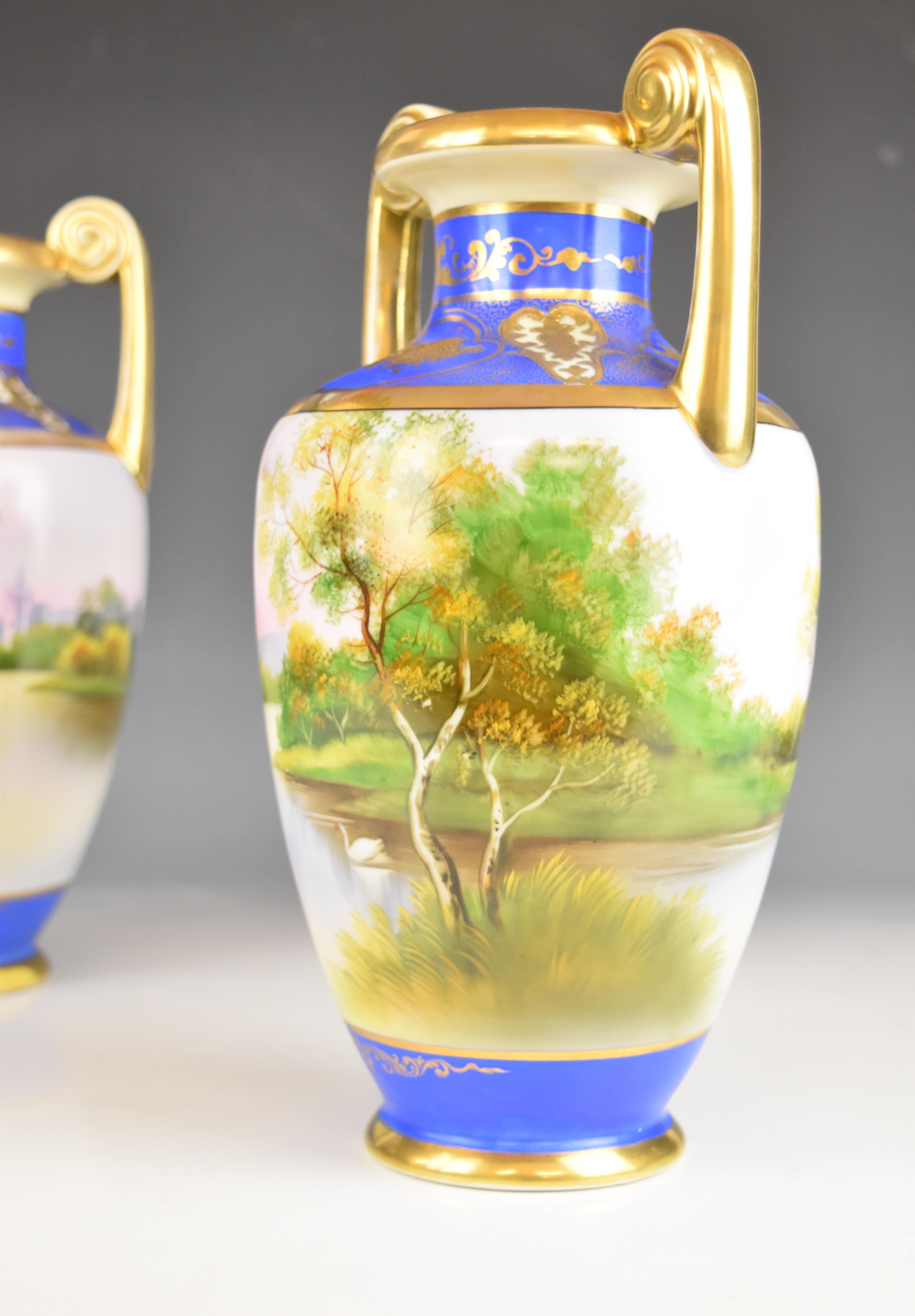 Noritake pair of twin handled pedestal urn shaped vases with pastoral decoration, height 30cm - Image 2 of 14