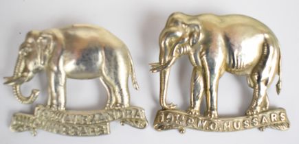 Two British Army 19th Hussars elephant design cap badges