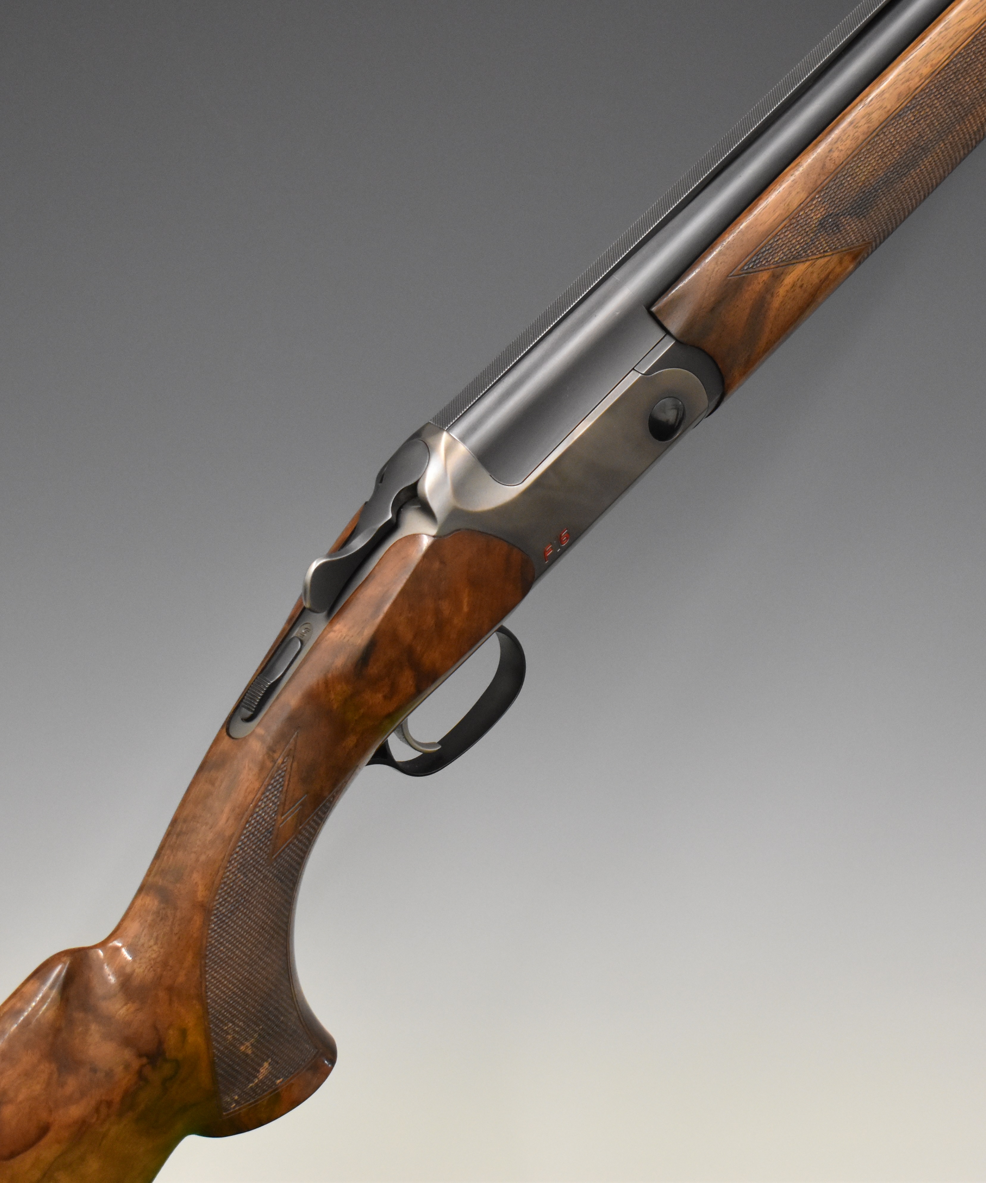 Blaser F16 12 bore over under ejector shotgun with named locks and underside, chequered semi-