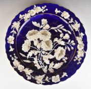 19th / 20thC Bohemian charger with relief moulded white flower decoration on a navy ground, diameter